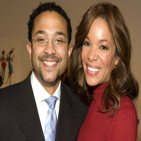 Emmanuel Hostin and his wife, both has cute smile on their face.